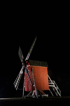 Illuminated old traditional windmill at the Swedish island Oland, a symbol for the island of sun and wind in the Baltic Seaの写真素材
