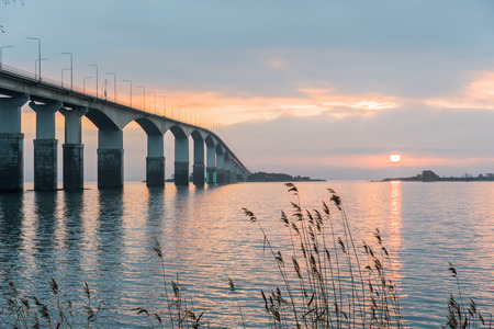 Sunrise by The Oland Bridge, connects the swedish island Oland in the Baltic Sea with mainland Swedenの写真素材