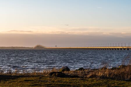 The Oland Bridge in evening sunshine - connecting the island Oland with mainland Swedenの写真素材