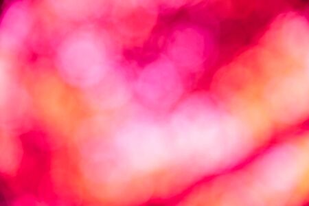 Red bokeh defocused background and texture from naturalの写真素材