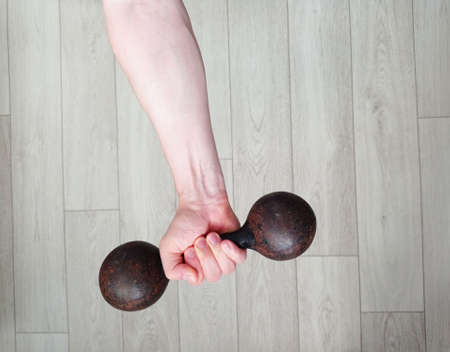 Male hand with dumbbells, sportの写真素材