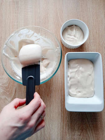 Unfolding the creamy white mass into shapesの写真素材