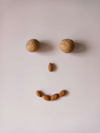 Smile made of nuts. Walnuts and almondsの写真素材
