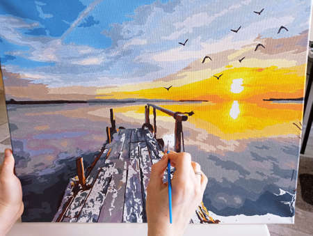 The artist paints a picture. Drawing process.の写真素材