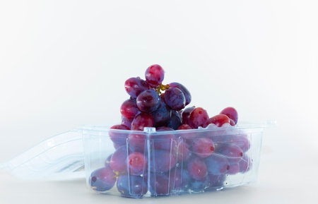 Blue grapes for dessert with a cup of coffeeの写真素材