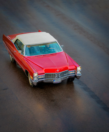Red old american car on the road. Selective focus.のeditorial素材
