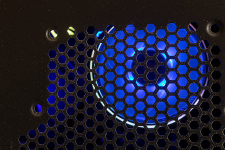Closeup of a blue and black computer fan with blue led lights.