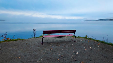Bench on the shore of Lake Baikal in autumn, Russiaの写真素材