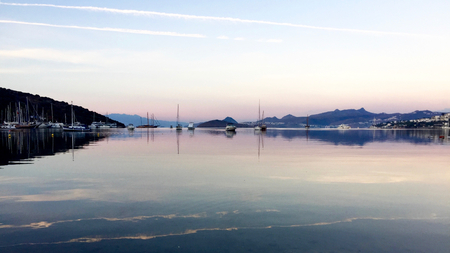Sunrise at the Aegean sea cost. Calm blue water. Bitez. Bodrumの写真素材