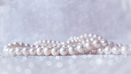 Nature white pearl beads on sparkling backgroundの写真素材