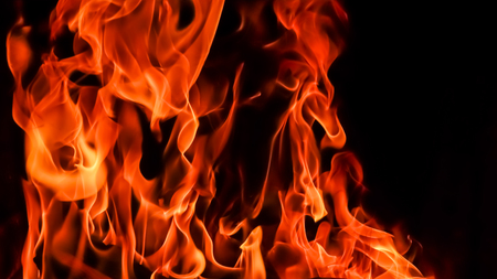 Flames of fire on a black background. The mystery of fire.の写真素材