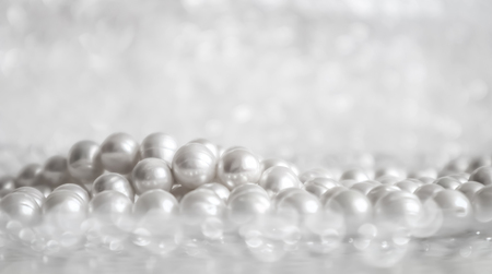 Nature white pearl beads on sparkling backgroundの写真素材