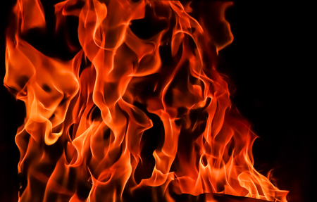 Flames of fire on a black background. The mystery of fire.の写真素材