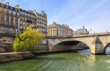 One of the oldest bridge ( Pont Royal ) across Seine River and  beautiful historic buildings of Paris France. April 2019の写真素材