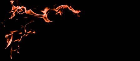 Flames of fire on a black background. The mystery of fire.の写真素材
