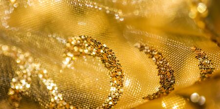 Golden abstract blur defocused background.の写真素材