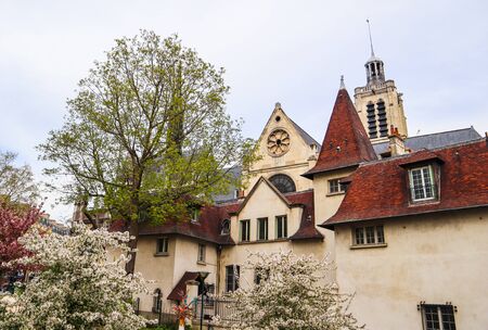 Square Saint-Laurent Church in Paris France with blossom trees in spring 2019
