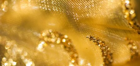 Golden abstract blur defocused background.の写真素材