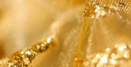 Golden abstract blur defocused background.の写真素材