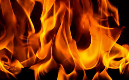 Red blaze Fire flame on a black backgroundの写真素材