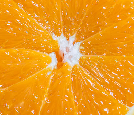 Orange fruit slice piece background. Close up view. High quality photo