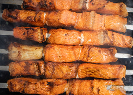 Fish kebab on skewers on the grill in winter. Salmon and halibutの写真素材