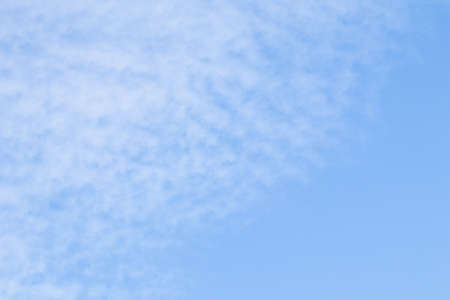 Background of blue sky with white cloudsの写真素材