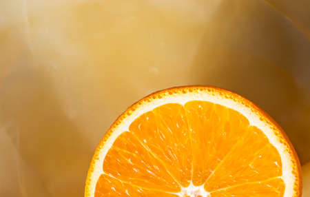Part of orange on marble onyx background.