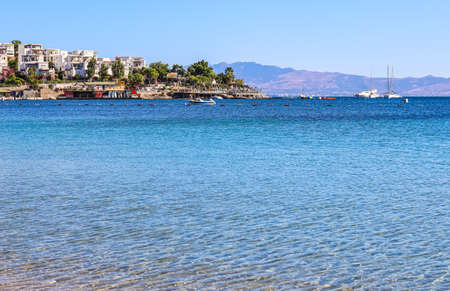Blue sea, boats, mountains and islands on the Aegean coast. Summer vacation and coastal nature conceptの写真素材