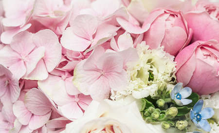 Beautiful flower bouquet arrangement close up in pastel colors. Decoration of roses and decorative plants, selective focusの写真素材