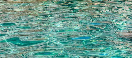 Emerald sea water in sunshine glow as surface background. Summer holidays conceptの写真素材
