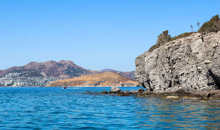 Blue sea water, beautiful natural rocky seashore and islands. Summer vacation and coastal nature conceptの写真素材