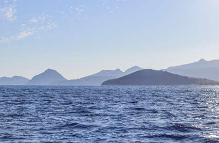 Blue sea with islands and mountains. Summer holidays concept. Coastal nature backgroundの写真素材