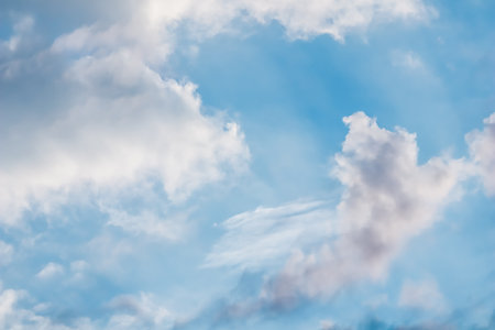 Background of blue sky with beautiful natural white clouds.の写真素材