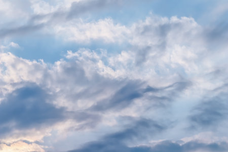 Background of blue sky with beautiful natural white clouds.の写真素材