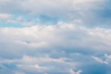 Background of blue sky with white clouds. Natural backdropの写真素材