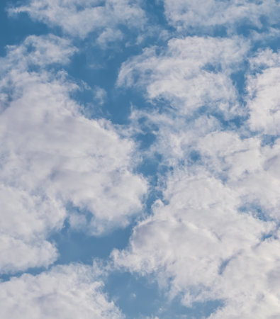 Background of blue sky with white clouds. Natural backdropの写真素材