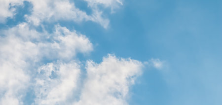 Background of blue sky with white clouds. Natural backdropの写真素材