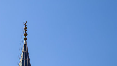 Mosque Minaret on a background of blue sky in Bitez, Bodrum, Turkiyeの写真素材