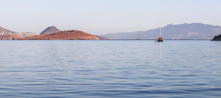 Blue sea, boats, islands and mountains. Calm seascape and coastal nature. Vacation conceptの写真素材