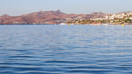 Blue sea, boats, mountains and islands on the Aegean coast. Summer vacation and coastal nature conceptの写真素材