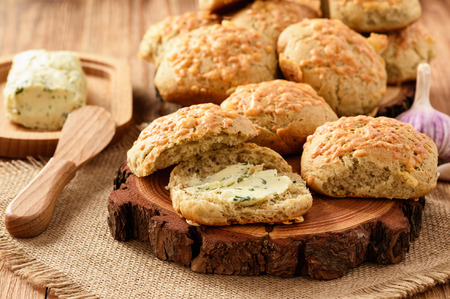 Homemade fresh bread buns with cheese and garlic butter.の写真素材