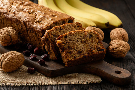 Homemade banana bread on wooden background.の写真素材