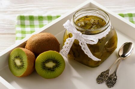 Homemade kiwi jam in glass jar.の写真素材