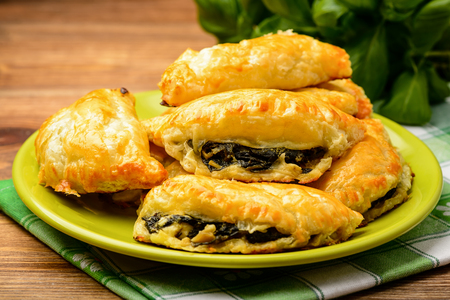 Puff pastries with spinach and cheese.の写真素材