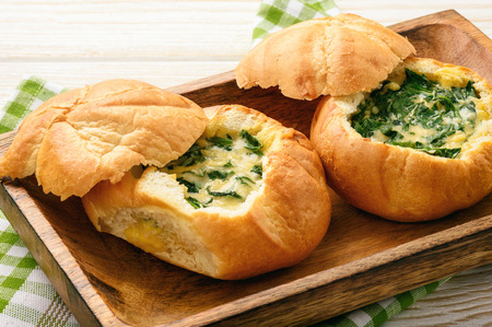 Buns baked with spinach, cheese and egg.の写真素材
