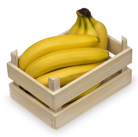 Fresh bananas in wooden crate box isolated.の写真素材