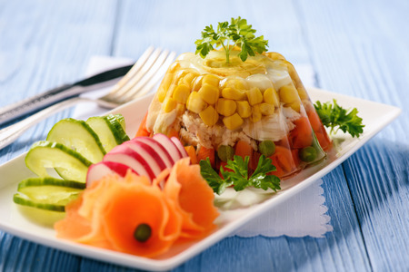 Aspic-jellied chicken with egg and vegetables.