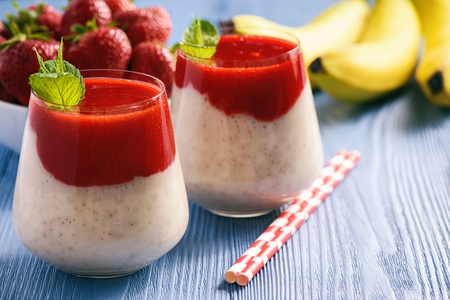 Healthy yogurt dessert with banana and strawberry mousse.の写真素材