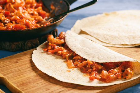 Enchiladas - mexican food, tortilla with chicken, cheese and tomatoes.の写真素材